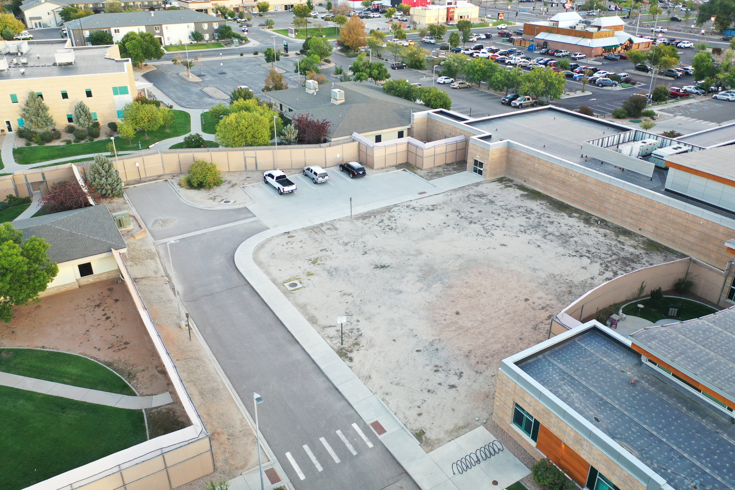 Original aerial photograph of the facility grounds and existing fencing