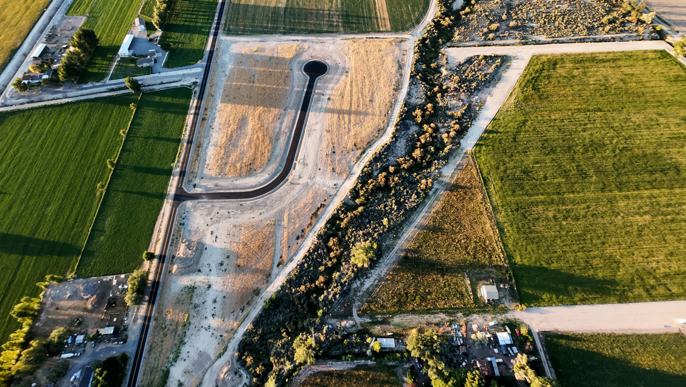 Overhead aerial photograph showing development roads and the surrounding land