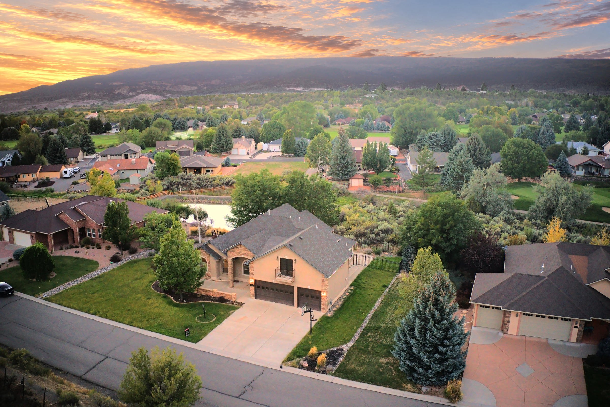Aerial photograph of a home in its neighborhood